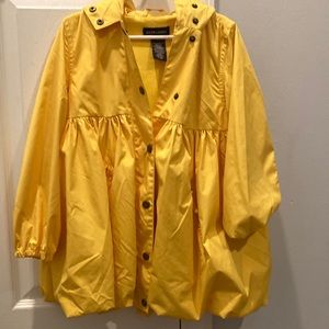 Extremely gently used yellow button up rain coat.
